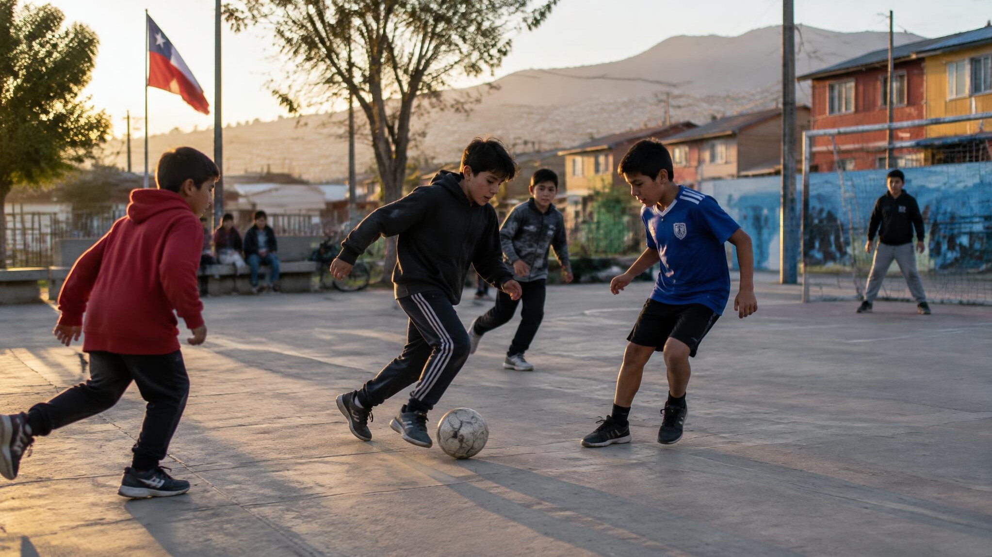 Children playing football in a public square in Chile