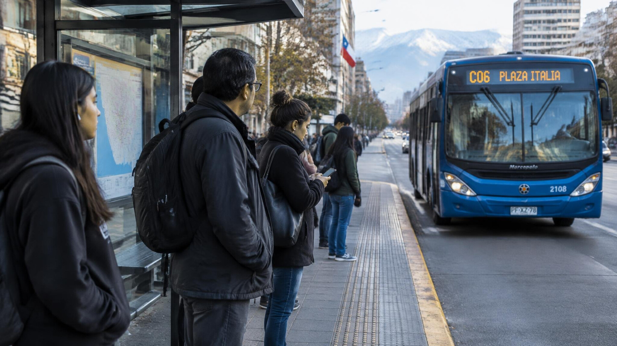 People waiting at a city bus stop in Chile
