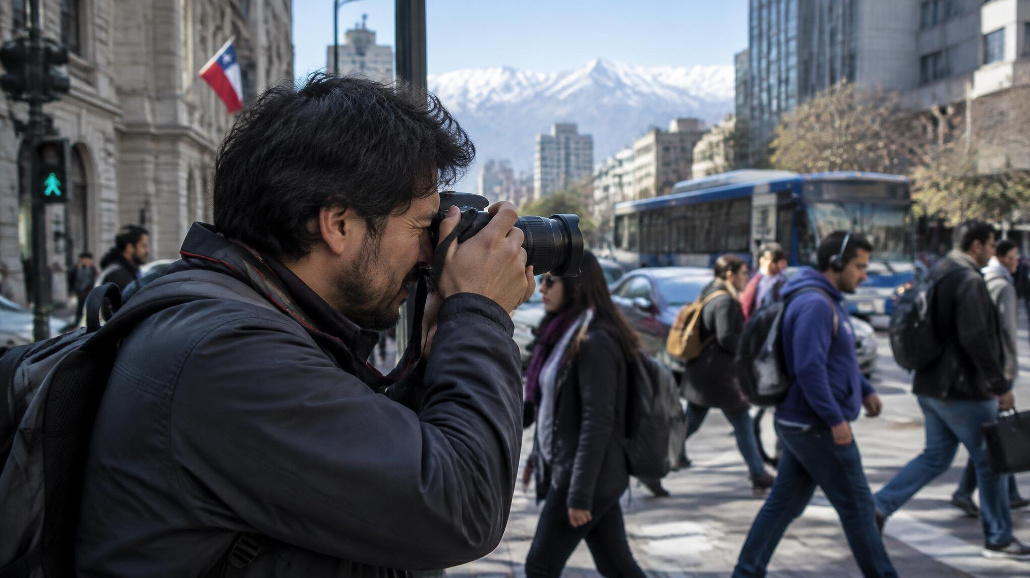 Photographer taking a photo of a city street in Chile